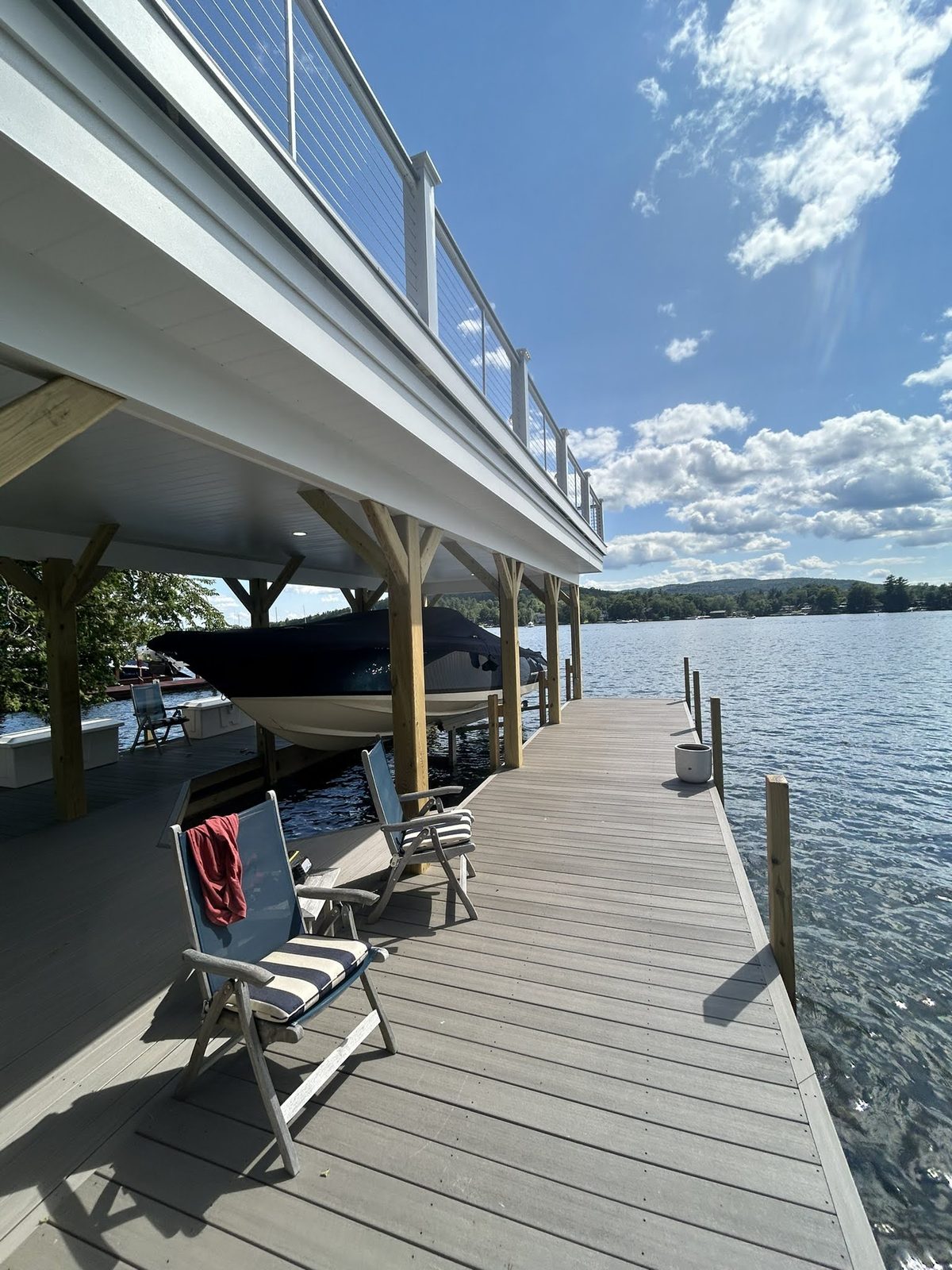 Covered boat slip with composite decking and cable railing