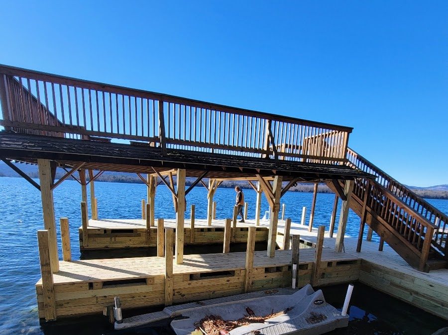 Boathouse with railed sundeck above covered slips on Lake George