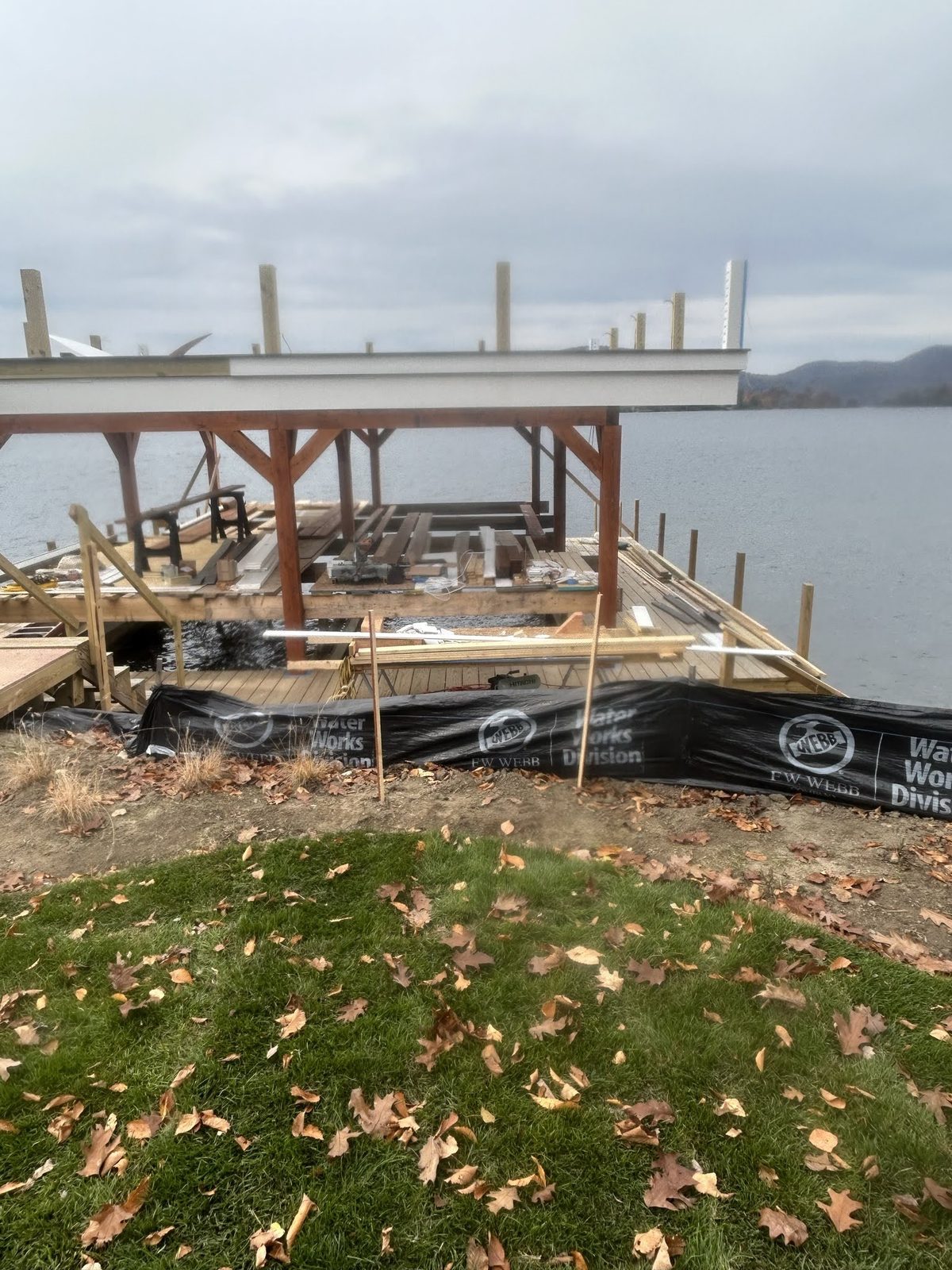 Boathouse frame staged on the lawn before placement