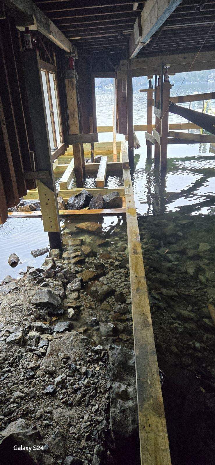 Piling and crib repair beneath an existing Lake George boathouse