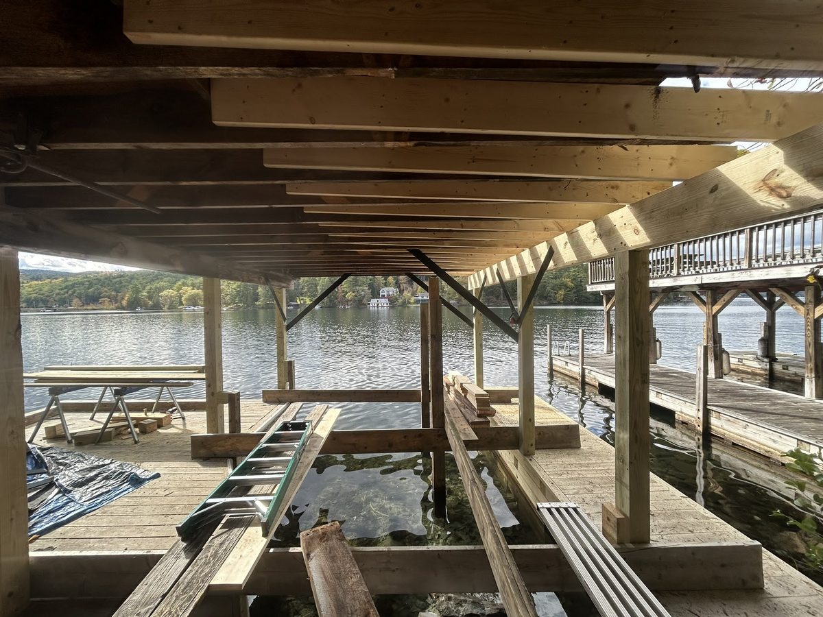 Structural underside of a boathouse deck during rebuild