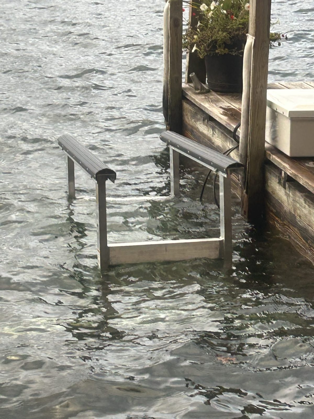 Boat lift hardware and dock structure at the waterline