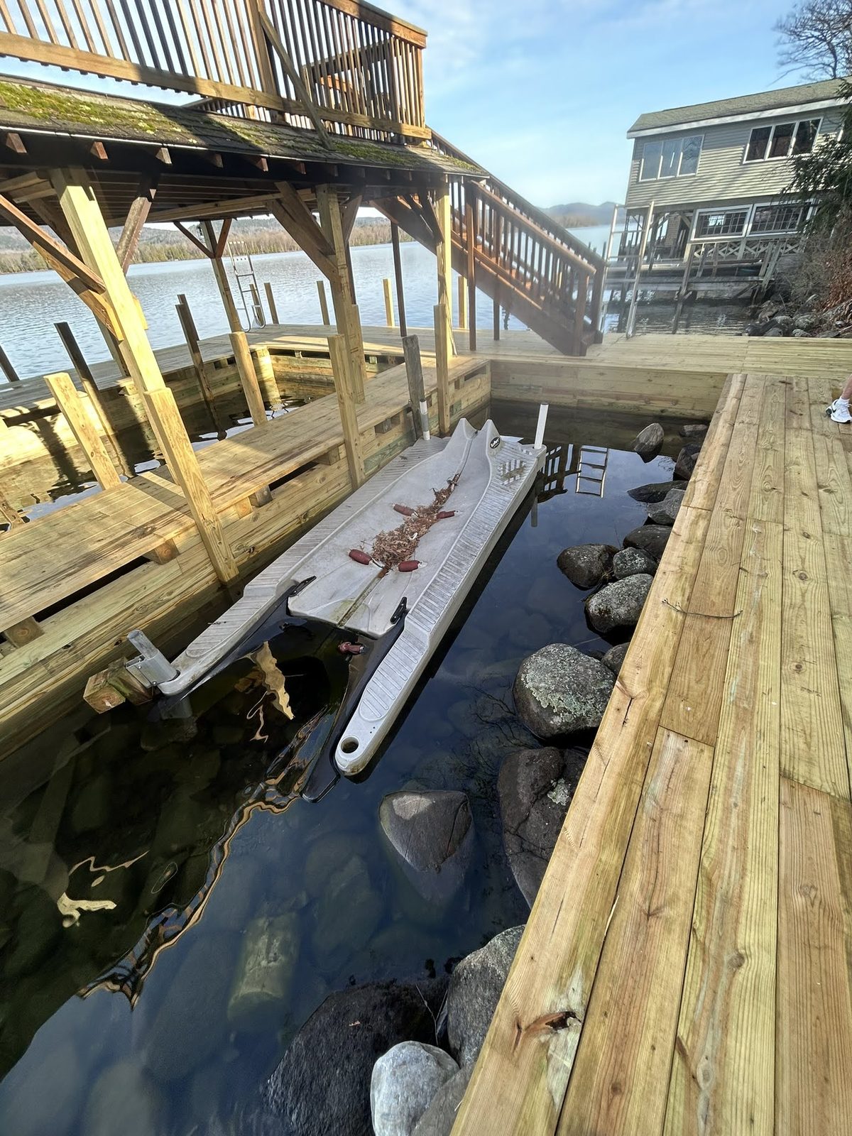 New boat lift and dock framing at a lakefront property