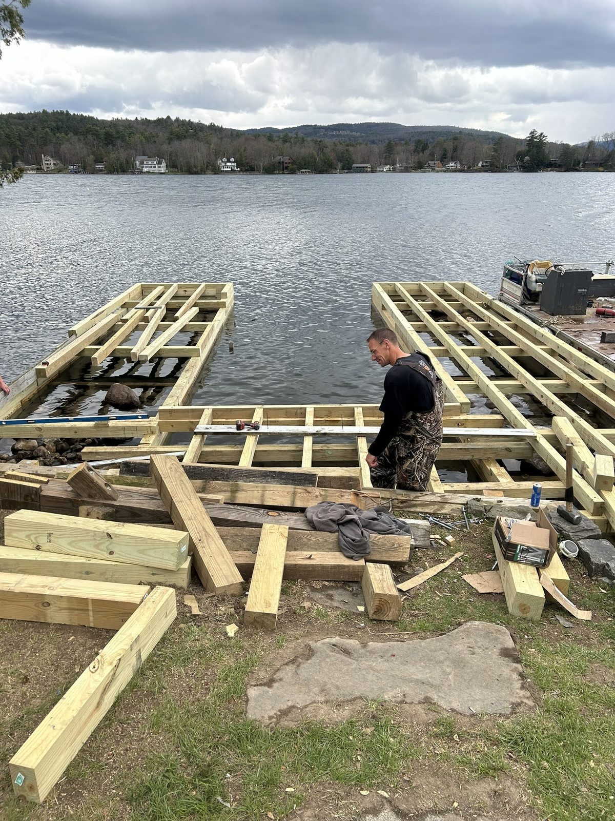 Crew assembling dock framing on the Lake George shoreline