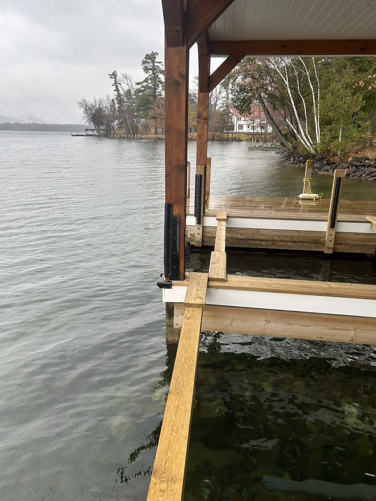 Covered dock and boardwalk along the Lake George shoreline