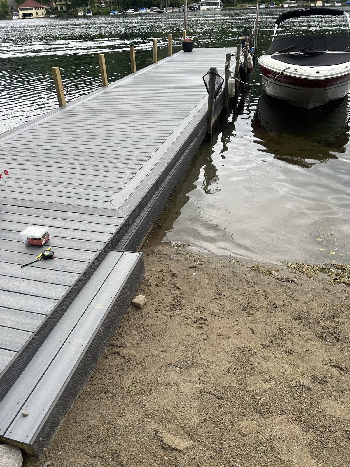 Composite dock with runabout moored alongside on Lake George
