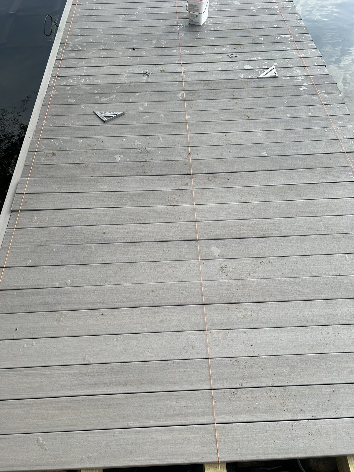 Close view of gray composite dock decking installed with hidden fasteners