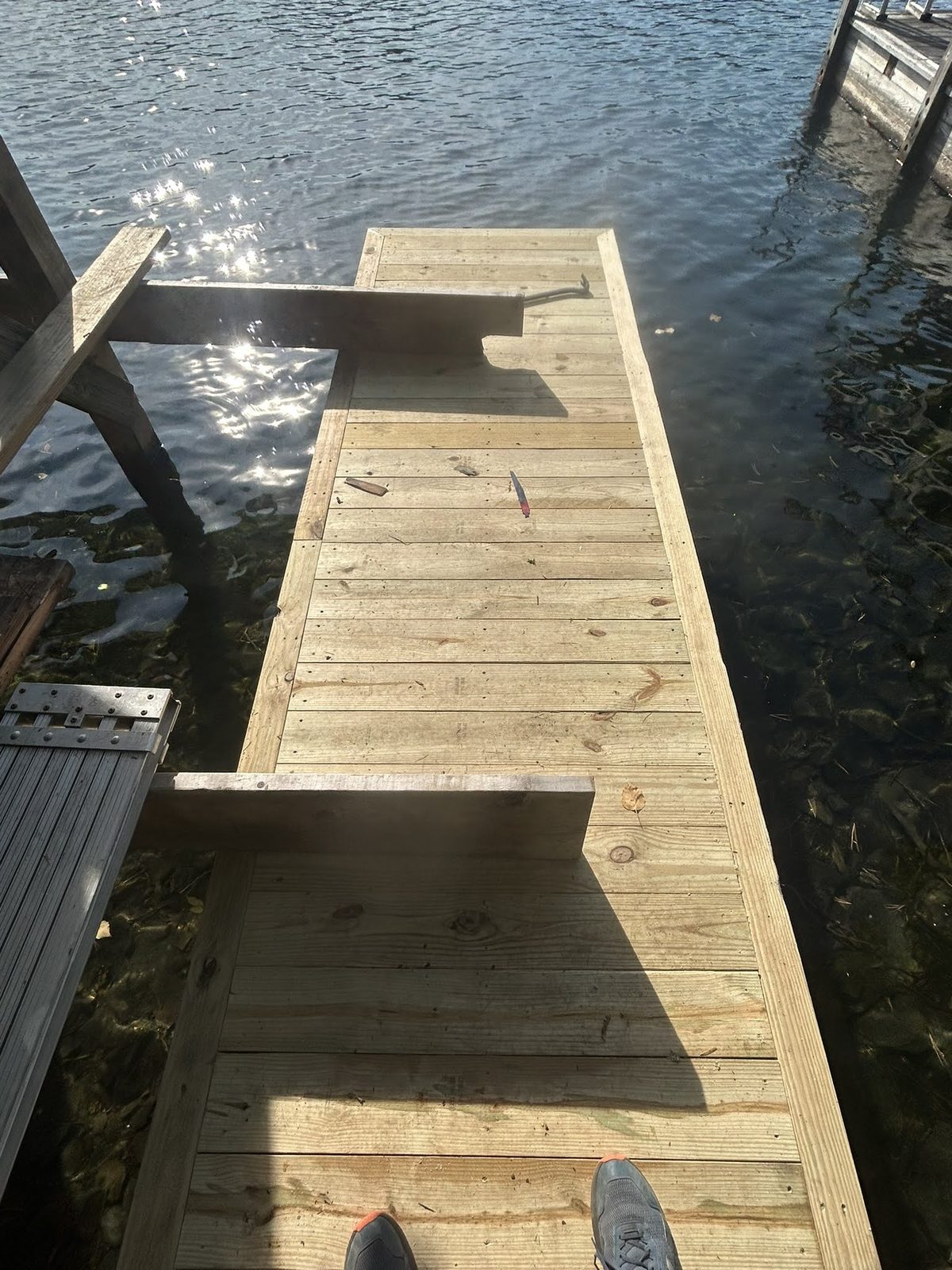 L-shaped timber dock with wide decking boards
