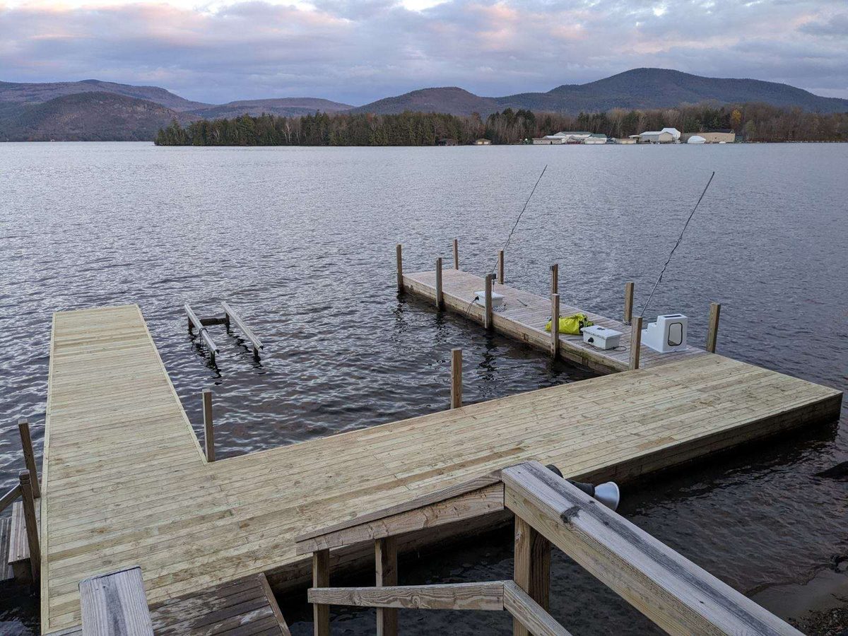 Timber pier and dock system on a gray Lake George afternoon