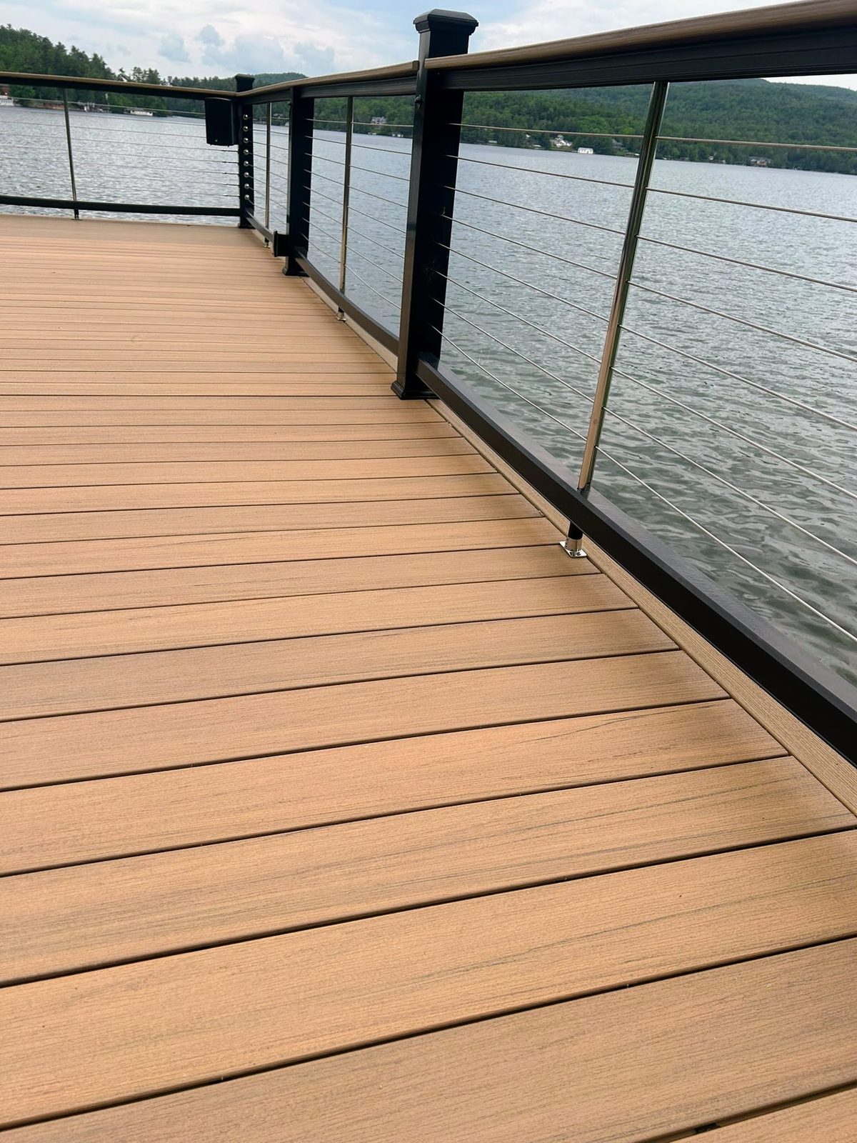 Composite dock with cable railing overlooking Lake George