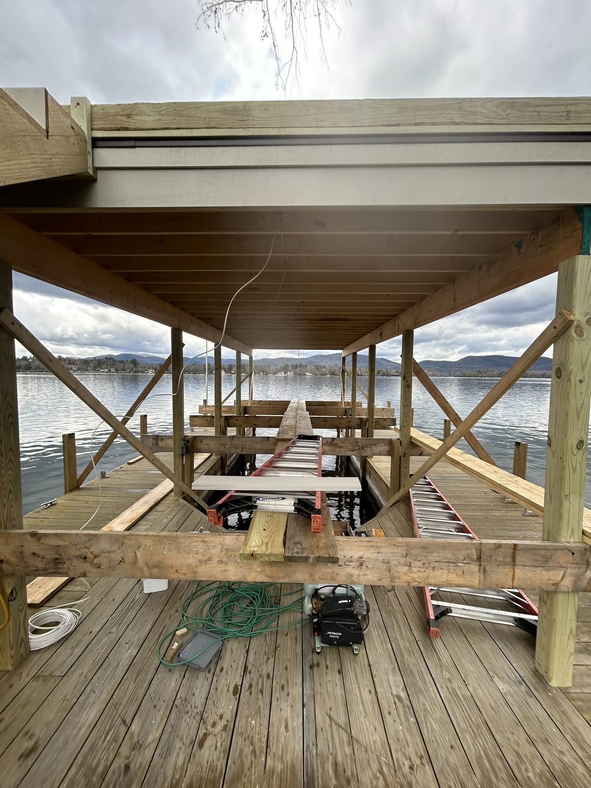 Underside of a dock deck showing steel framing and structural supports