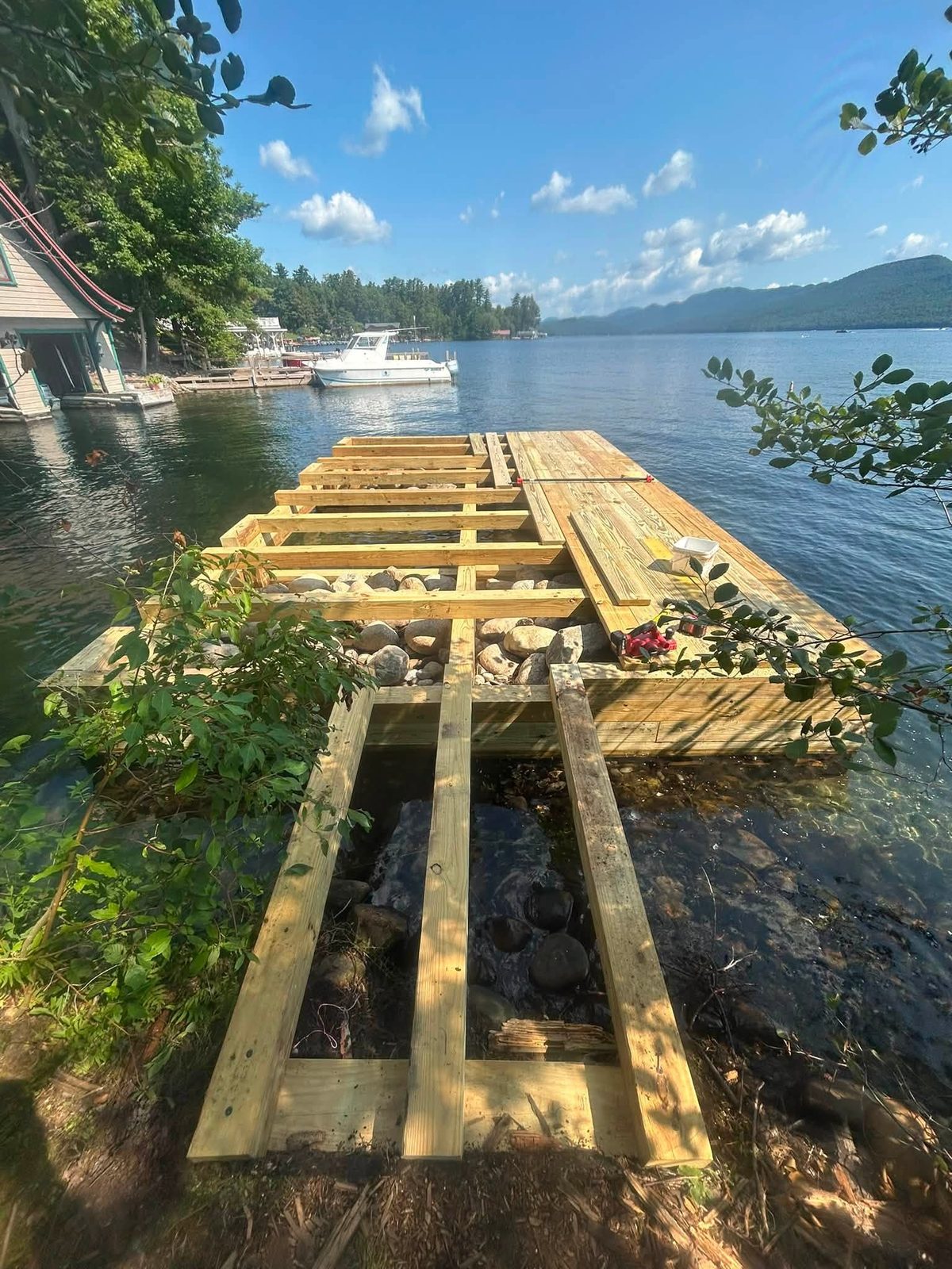 Shore approach walkway framed over crib rock leading to the new Fresh Water Institute dock