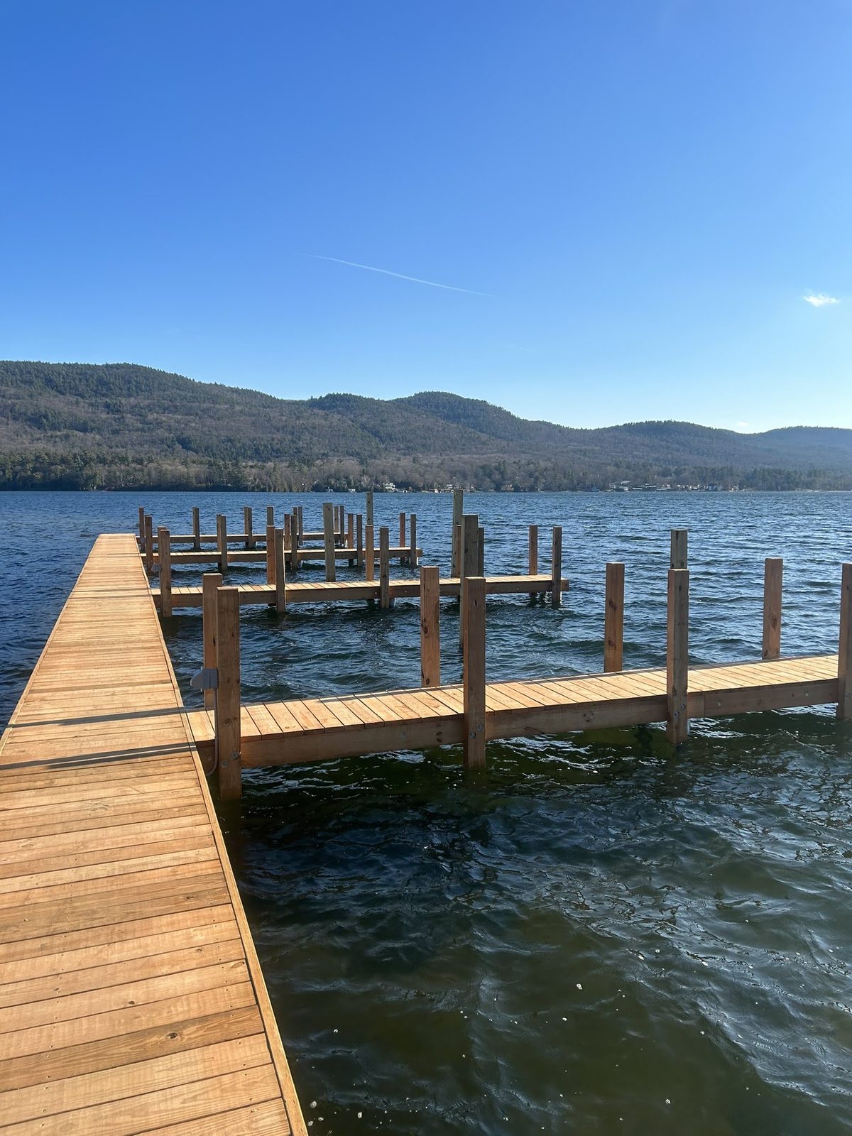 Crib dock on a calm morning with Lake George mountains in the distance