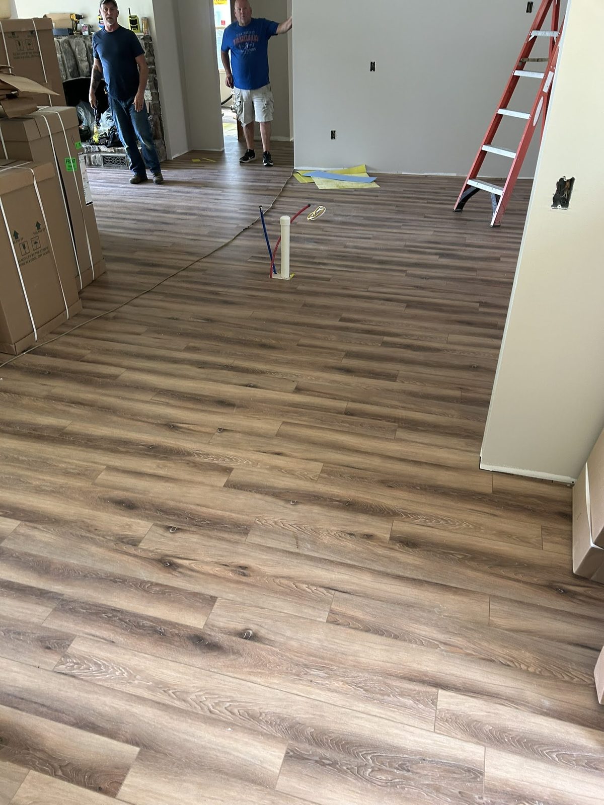 Interior renovation with new flooring and trim underway