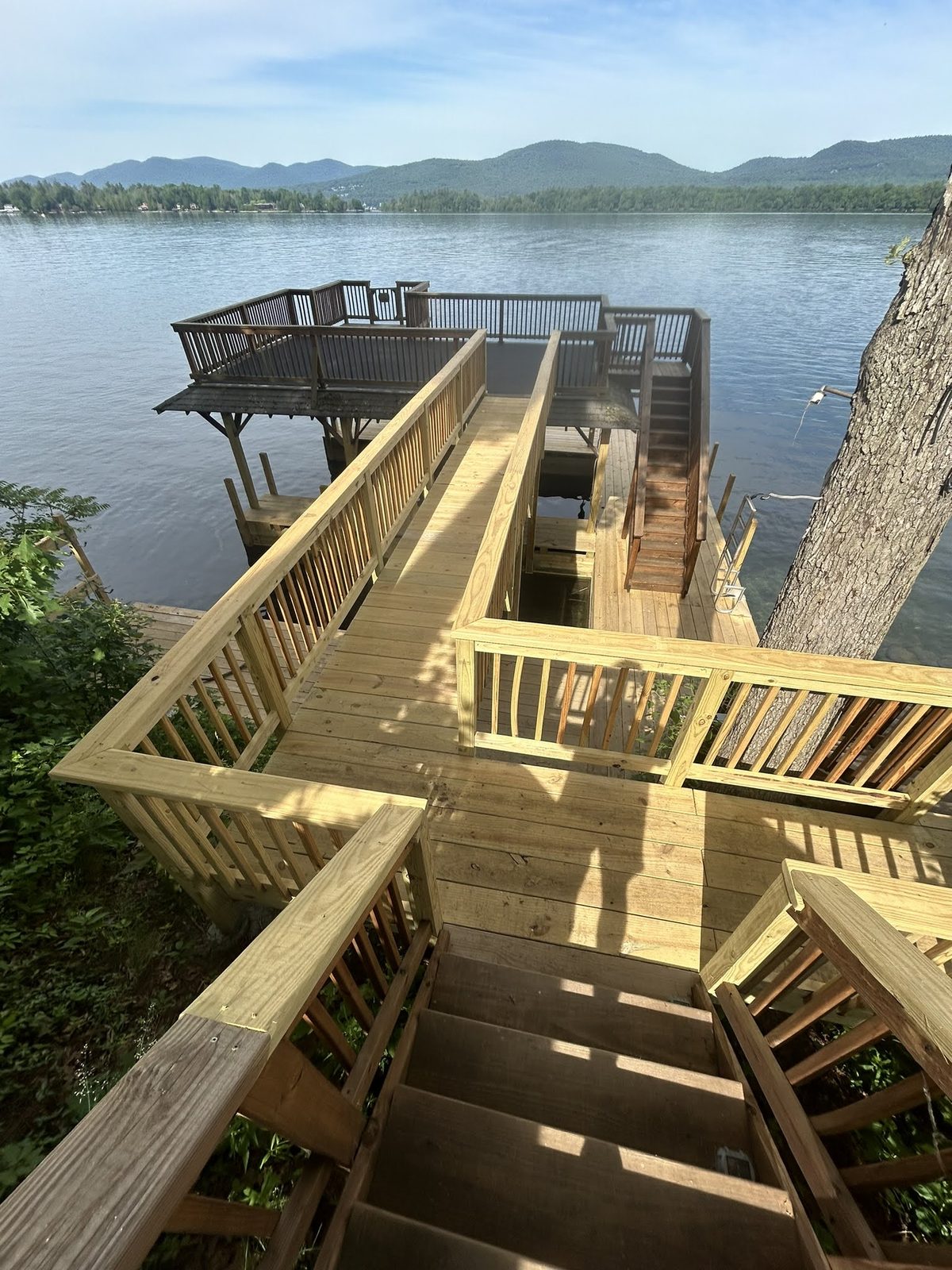 Elevated stairway and dock descending to Lake George