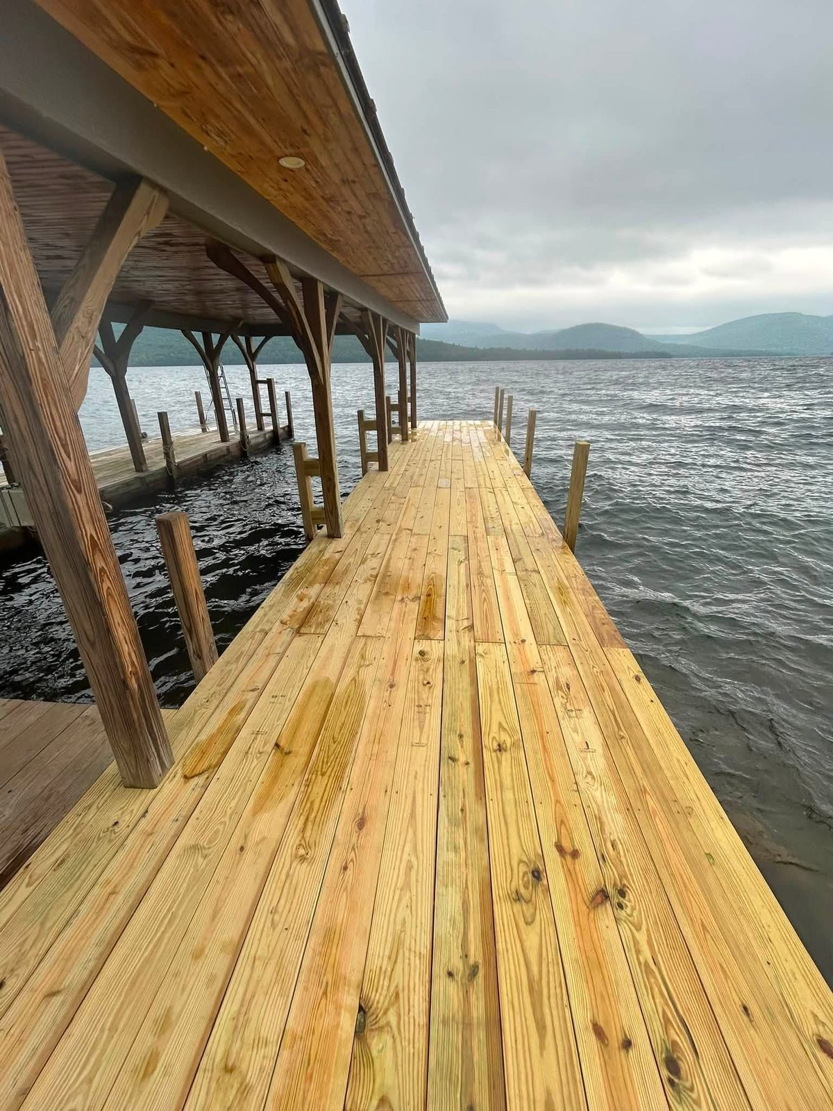 Completed dock repair in a sheltered Northwest Bay cove on Lake George