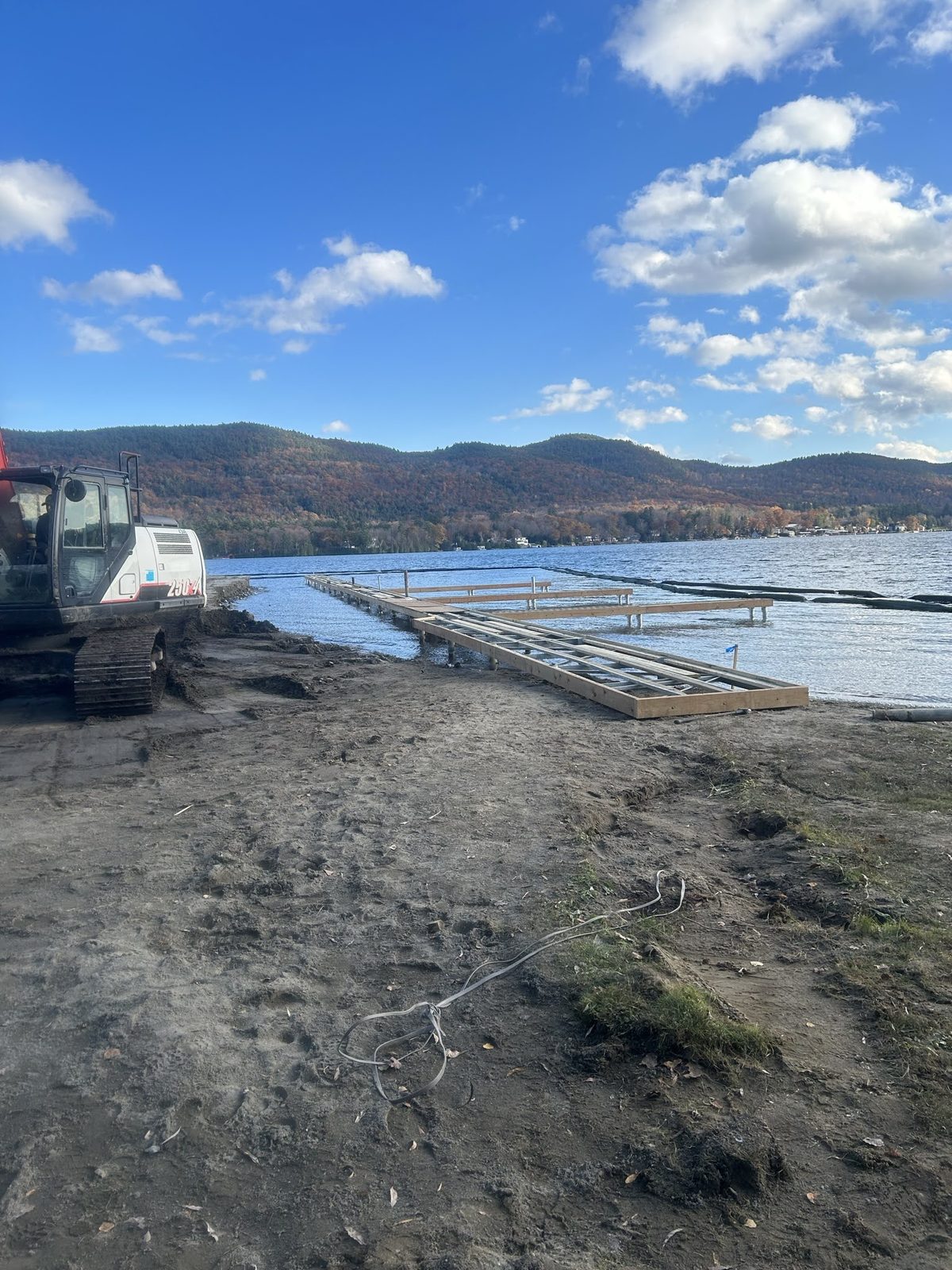 Equipment staged on a drawn-down Lake George shoreline in winter