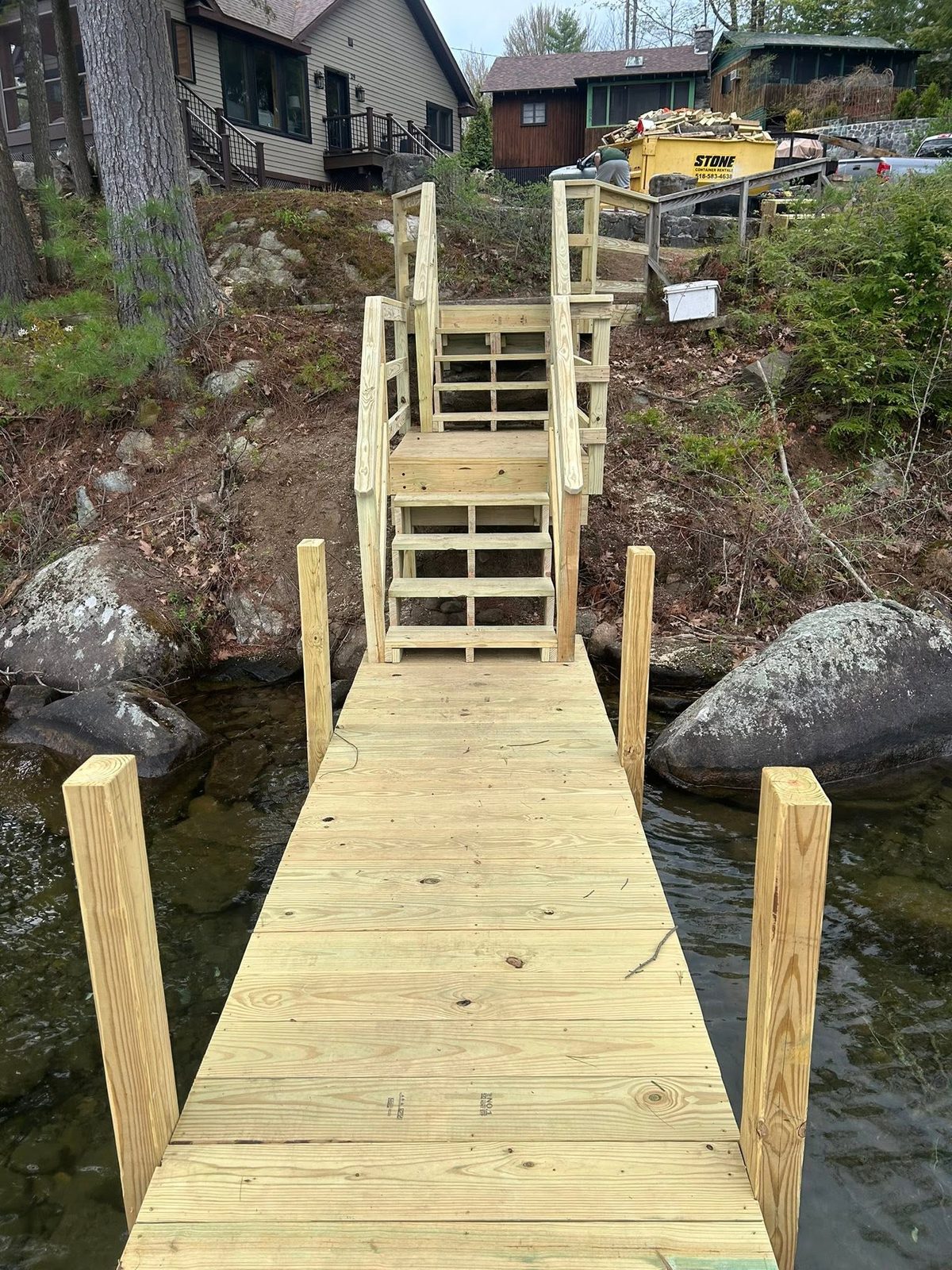 New stake dock installed on Lake George with access stairs to the shoreline