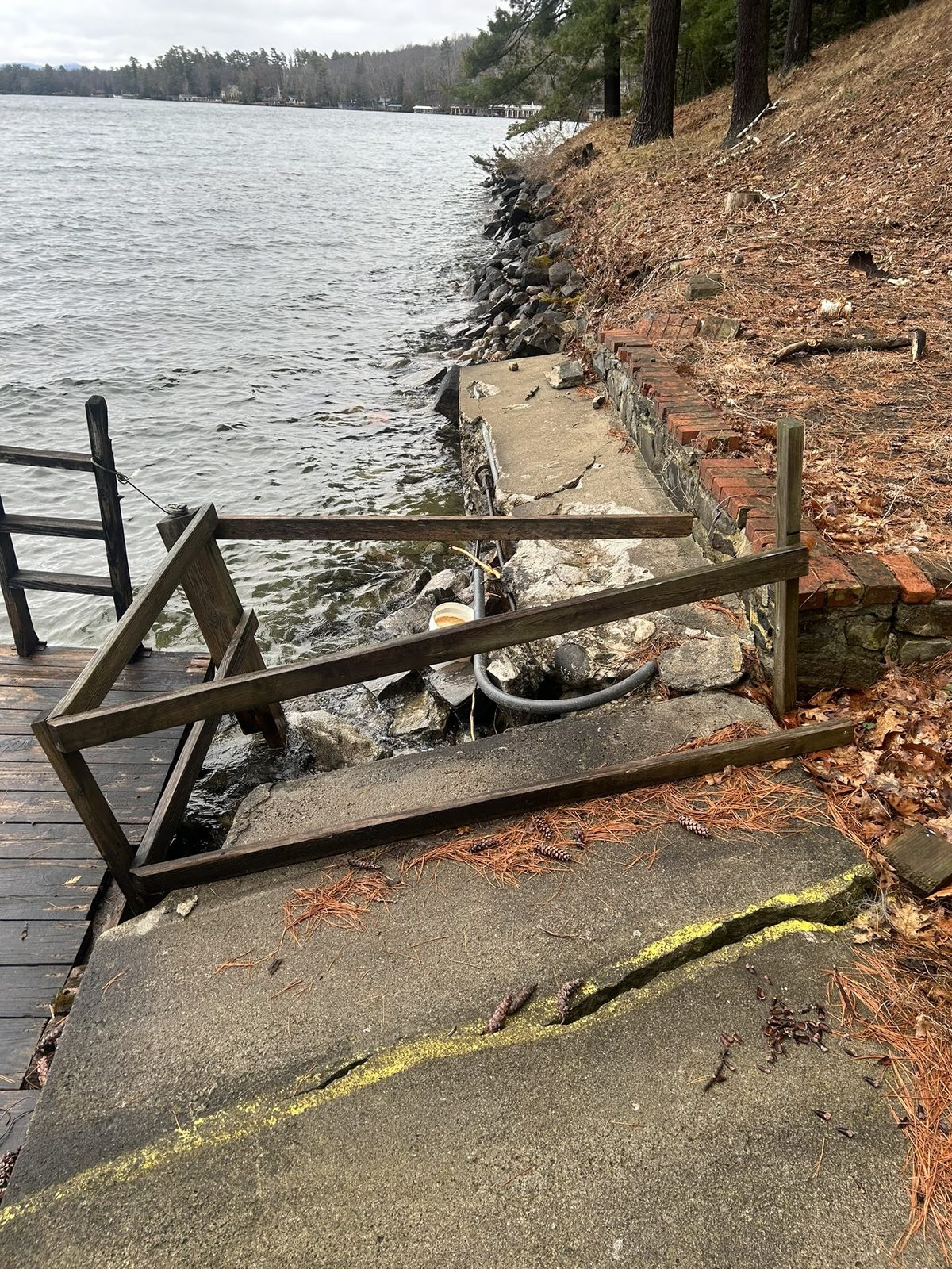 Collapsed dock railing and decking after winter damage